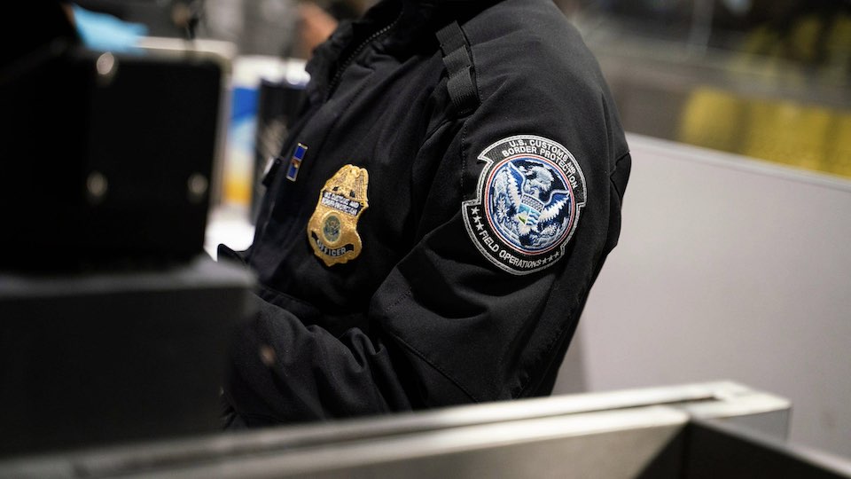 US Customs and Border Protection emblem on a border agent's uniform