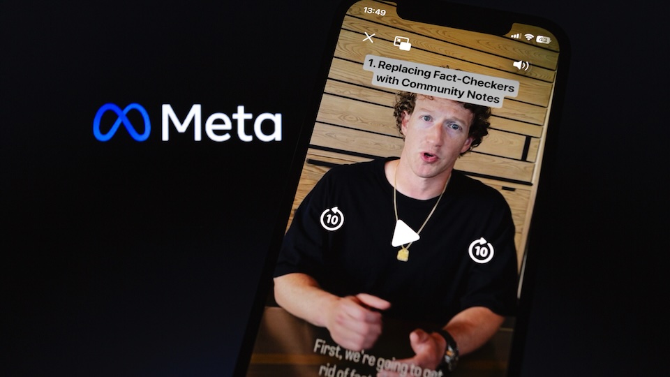 Zuckerberg's announcement video on a smartphone next to the Meta logo